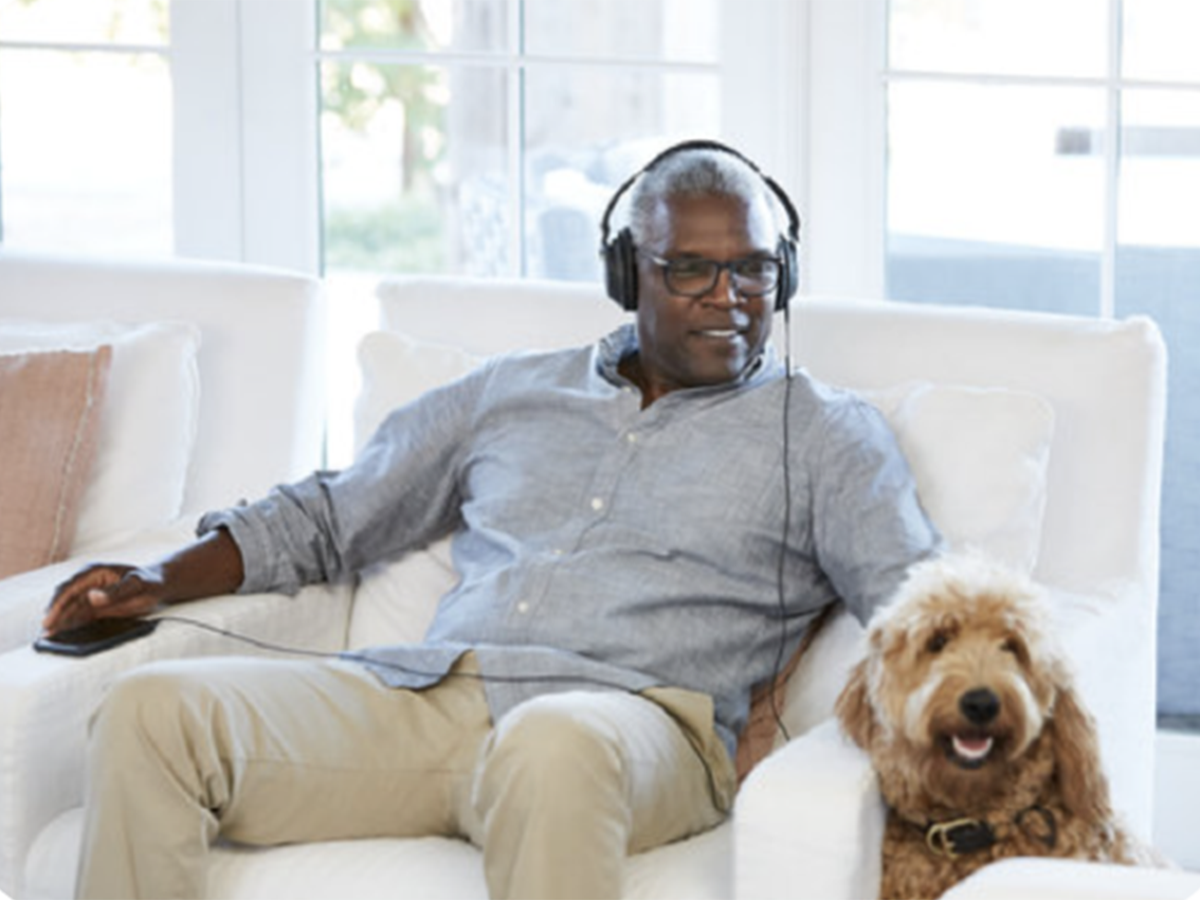 Man with headphones and dog